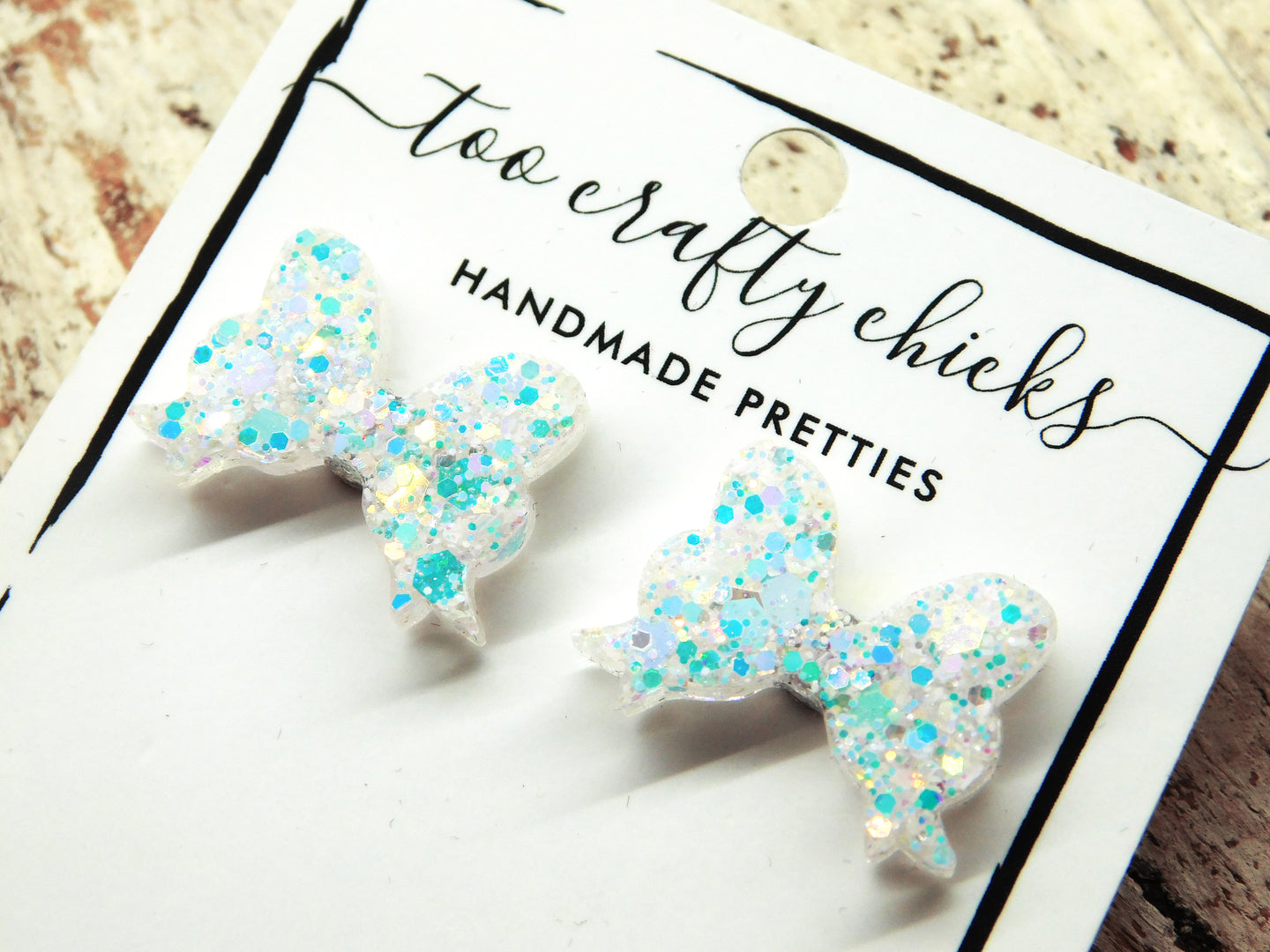 White Iridescent Bow Studs